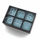 Personalised black ice tray featuring engagement rings, diamond, heart, initials R & S, and wedding date 19-11-1980
