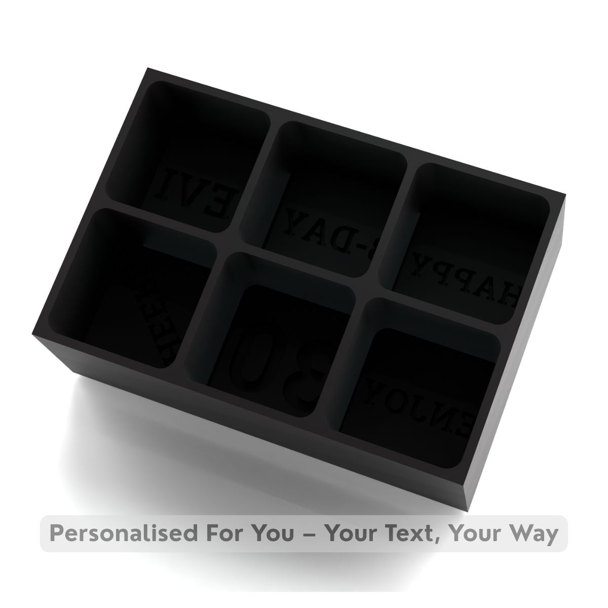 Black silicone ice cube tray with engraved text on a white background