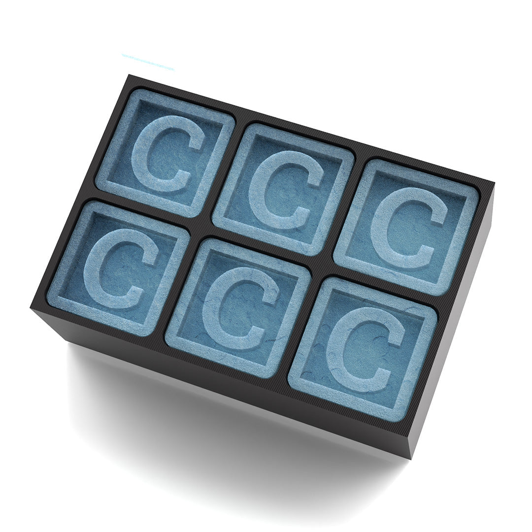 Black silicone ice tray with “C” cubes – makes his drinks personal and memorable