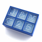 Blue silicone ice tray featuring J&M initials with heart and 25, perfect for weddings and anniversaries.