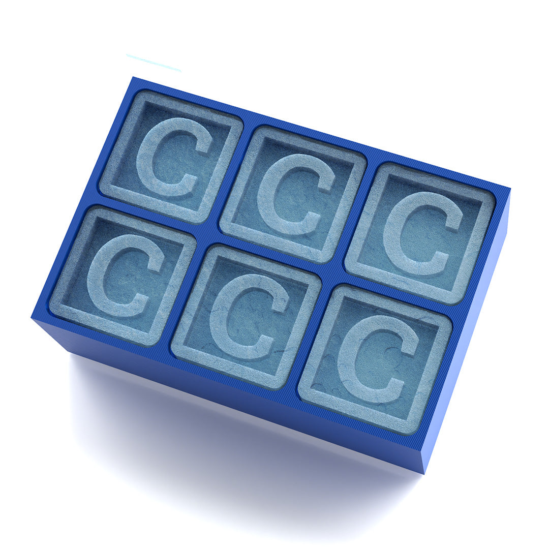 Bold blue ice tray with “C” cubes, designed as a thoughtful gift for men
