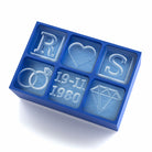 Custom blue ice cube tray with initials R and S, heart, diamond ring, and engraved wedding date