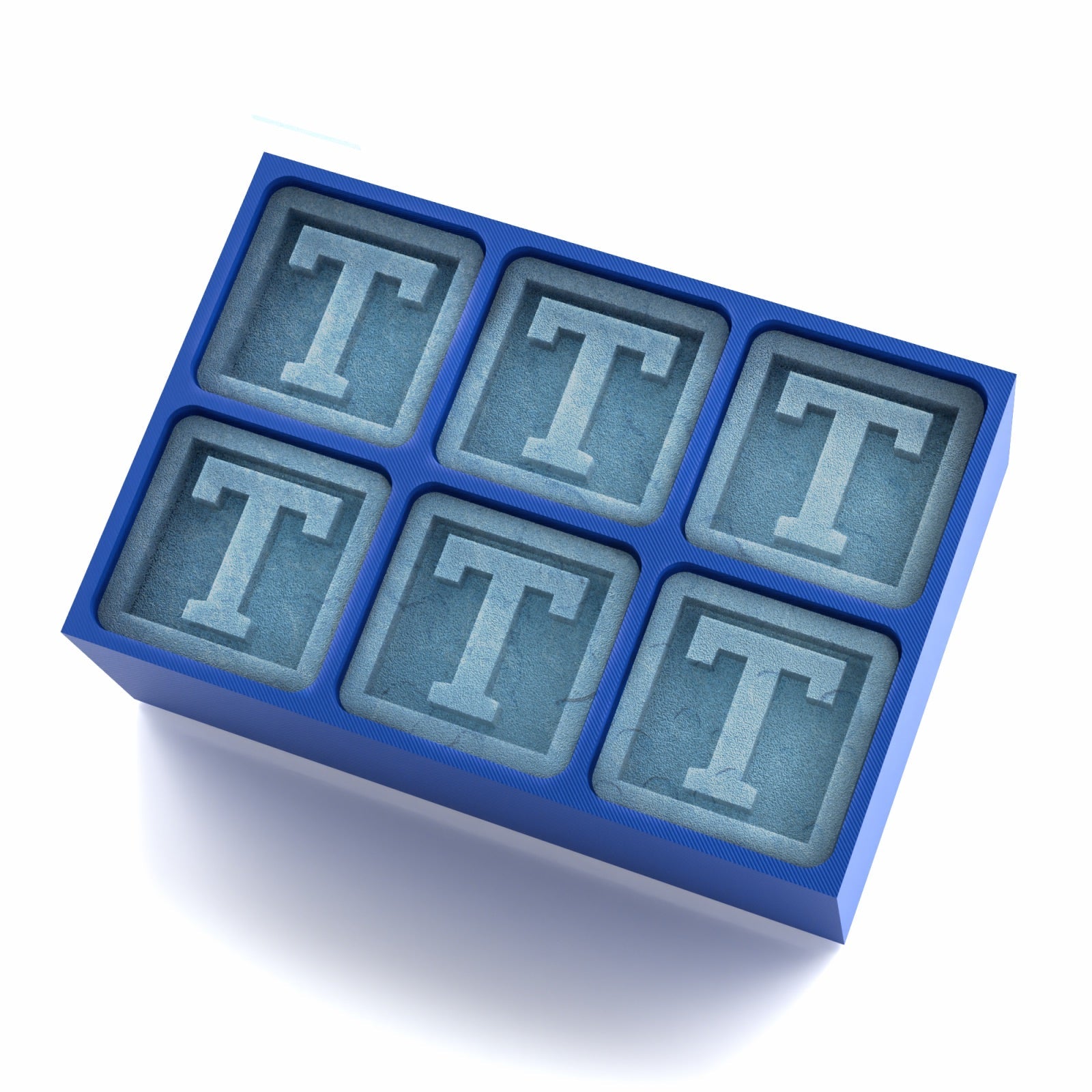 Bold blue ice tray moulding ‘T’ monogram cubes – the perfect personalised present for birthdays, parties, and whiskey lovers.