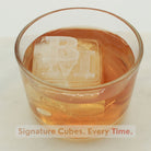 Smooth amber drink with a bold cube stamped s — a signature touch for  evenings or gifts.