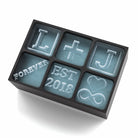 Black custom ice tray with couple initials L and J, plus signs, love symbols, and “FOREVER EST 2018” message in ice cubes