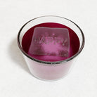 Pink drink featuring a clear raised-letter HAPPY ice cube made from a platinum-silicone tray, Australian handmade and perfect for personalised gifting.