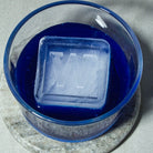 Blue drink with large W ice cube, custom made for milestone birthday parties and unique home bar experiences.