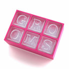 Pink custom ice tray with GROOMS lettering, playful wedding gift idea for grooms or bachelor parties.