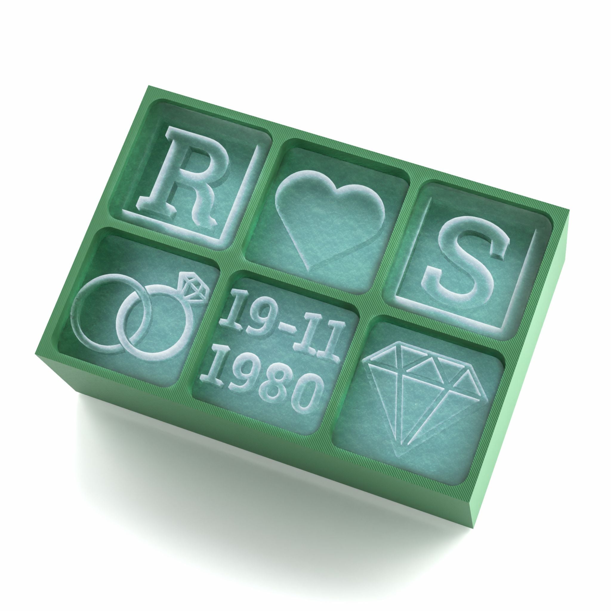 Green ice tray showcasing personalised wedding designs including rings, diamond, initials, and anniversary date