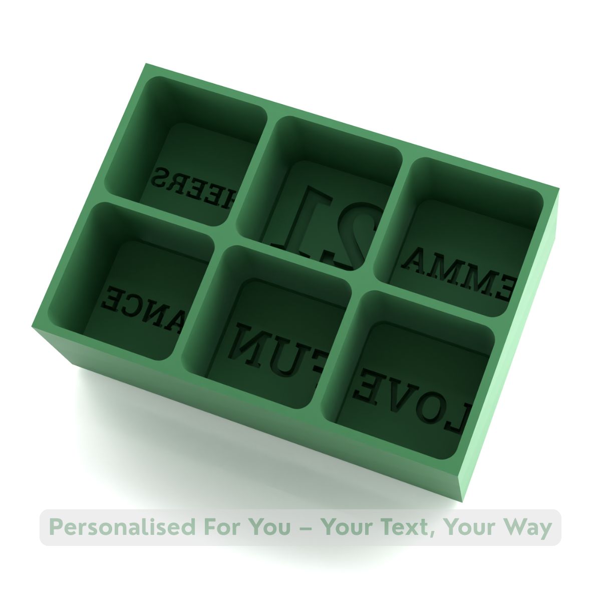Green silicone ice tray with six large cube cavities showing engraved words EMMA, 21, CHEERS, LOVE, FUN, and DANCE — handmade customisable ice mould.