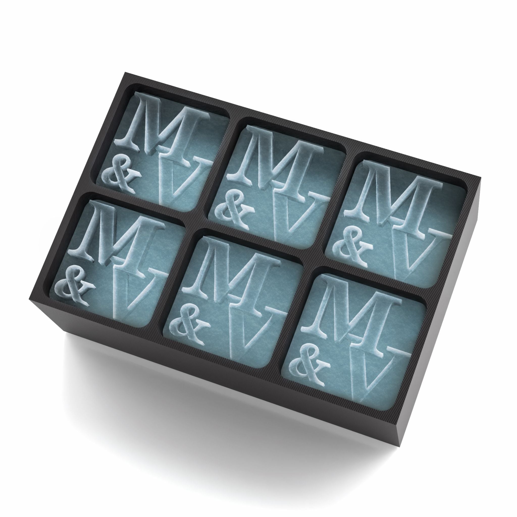 Stylish black silicone ice tray with raised M & V lettering, perfect for romantic celebrations