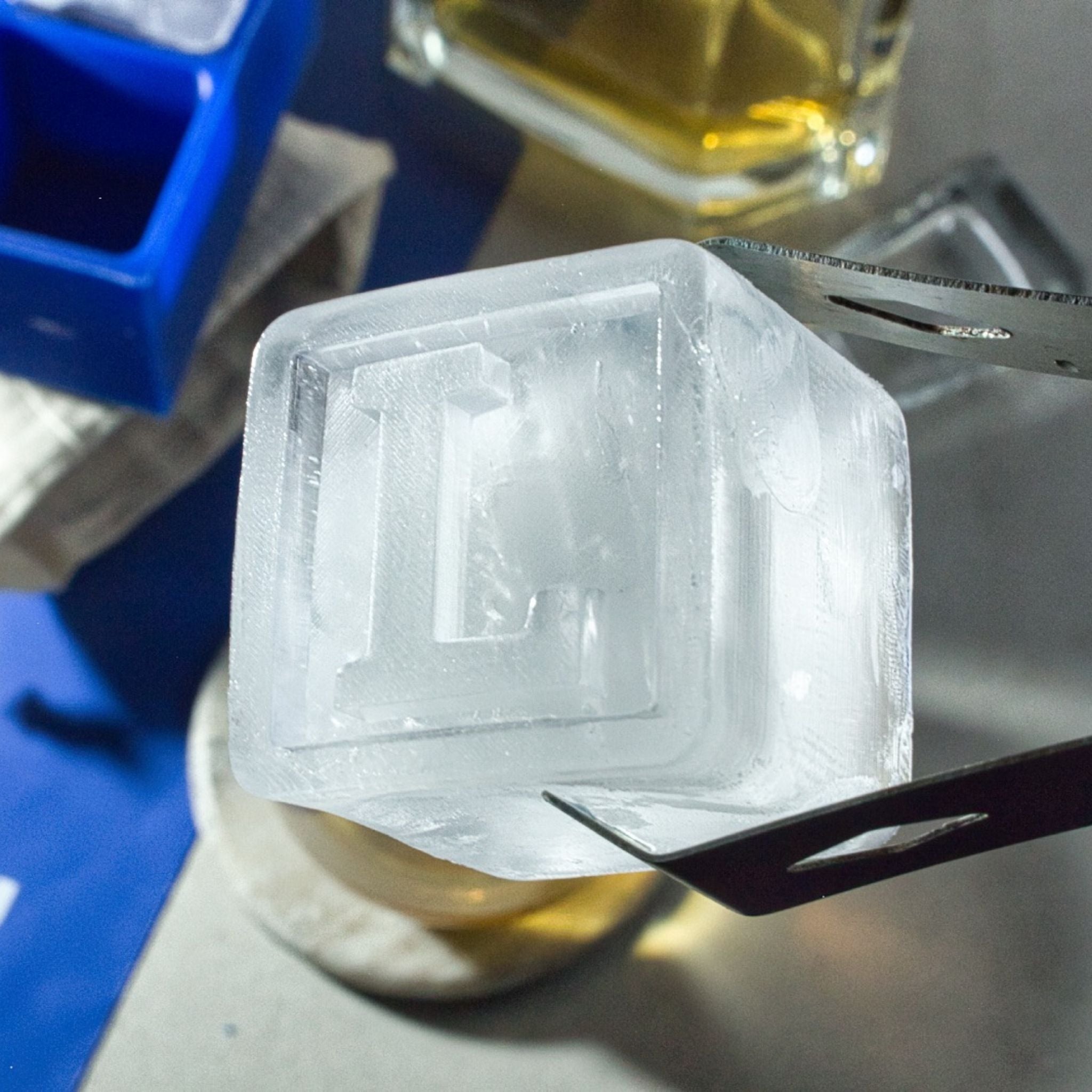 Extreme close-up of an L-shaped ice cube, showing detail and clarity, ideal for showcasing quality