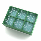Custom green ice tray with raised JS letters in ice cubes – great for summer gatherings or unique housewarming gifts.