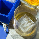 Whiskey glass with custom W ice cube and blue tray, showcasing a unique personalised birthday gift for home bar celebrations.