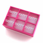 Pink silicone ice cube tray spelling HAPPY in each block – playful and bright birthday or event gift idea