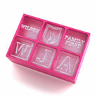 Pink custom ice cube tray with family symbols and engraved Wilson, Family First and initials – thoughtful gift for loved ones.