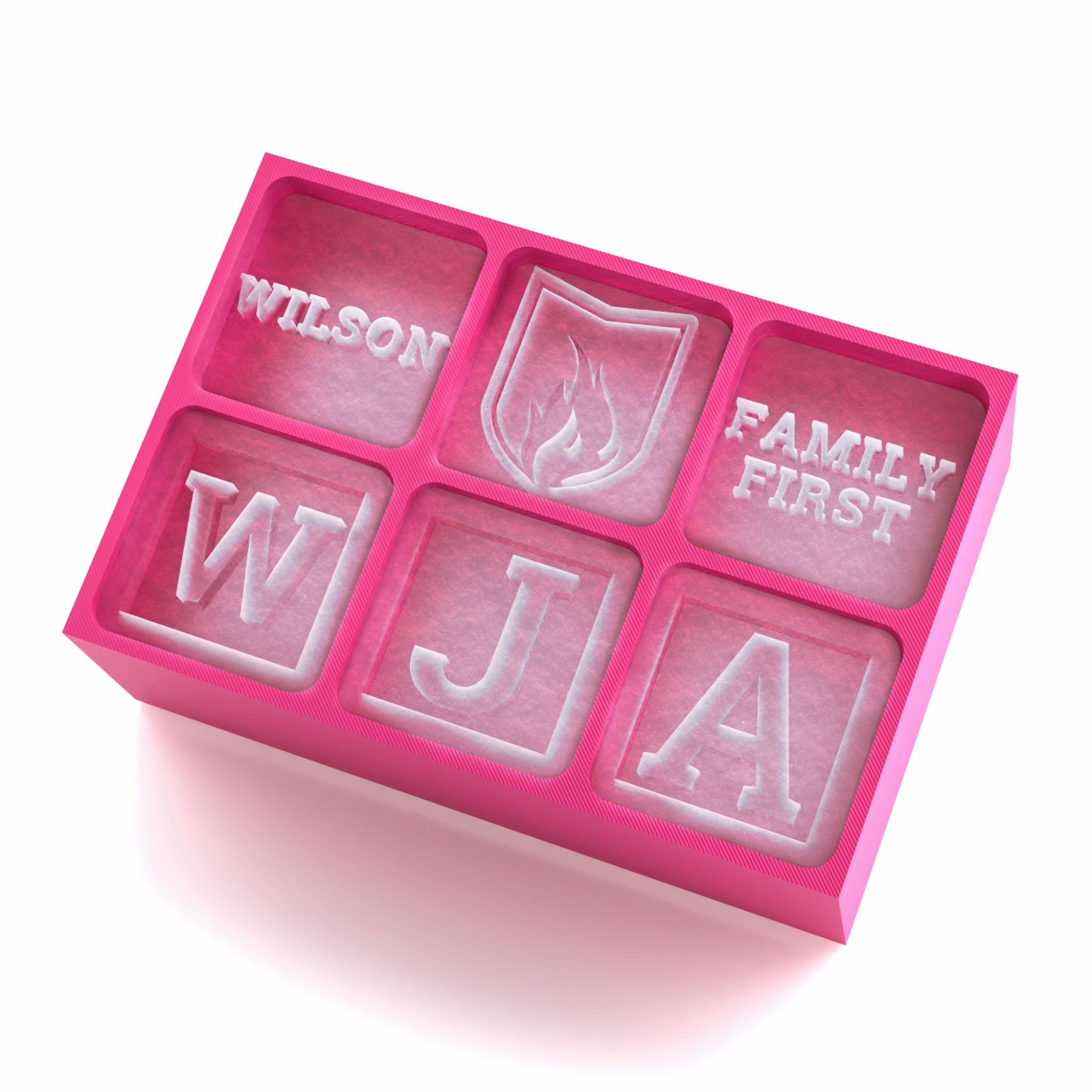 Pink custom ice cube tray with family symbols and engraved Wilson, Family First and initials – thoughtful gift for loved ones.