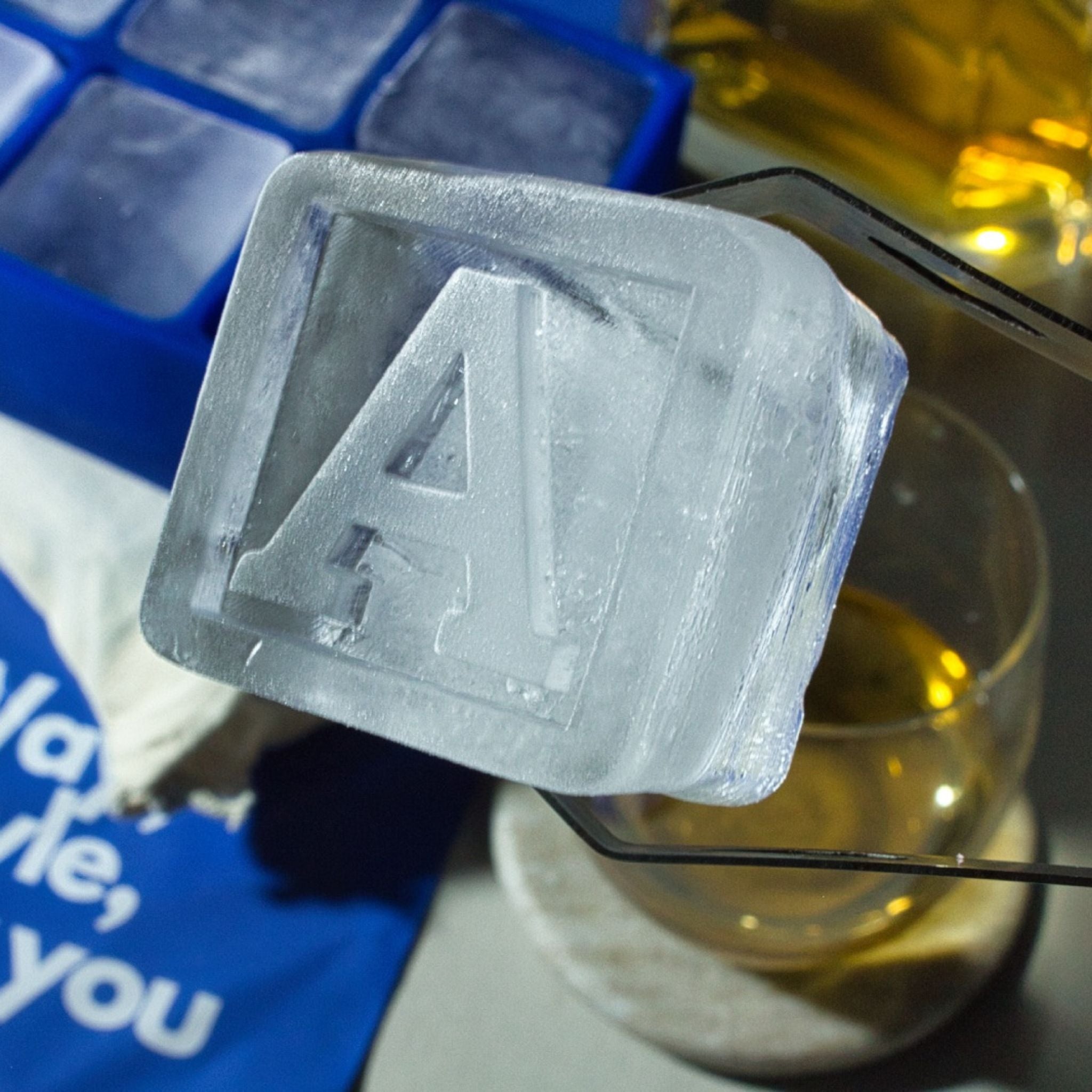 Close-up of a detailed A ice cube, perfect for unique barware gifts, birthdays, and personal celebrations