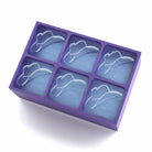 Six-cube purple silicone tray creating cowboy hat-shaped ice, designed for novelty drinks and themed celebrations