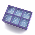 Purple personalised ice tray with J&M initials, heart design, and 25, designed for anniversaries and engagements.