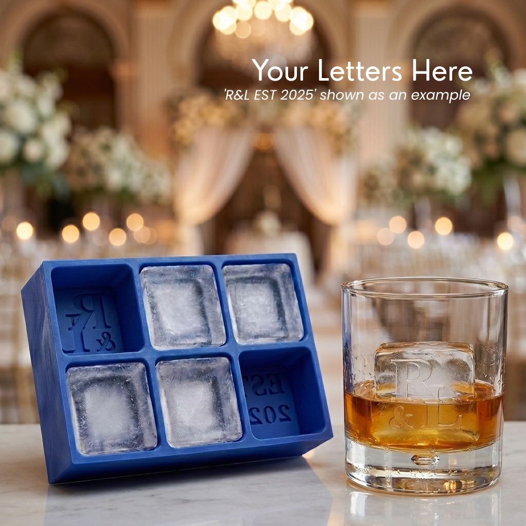 Blue R&L Est 2025 monogrammed ice cube tray with ice cubes styled beside a glass of whisky at an elegant wedding