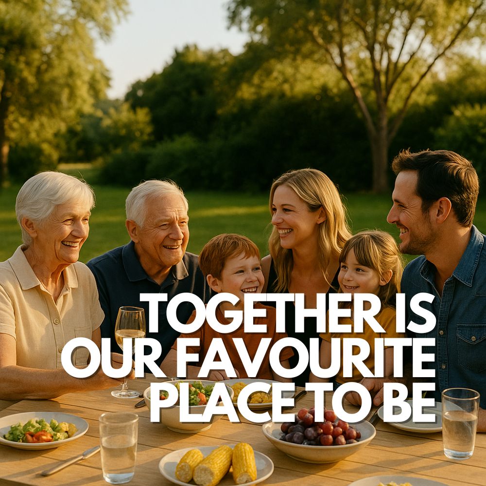 Group of smiling adults enjoying an outdoor meal together at sunset, with text overlay that reads “TOGETHER IS OUR FAVOURITE PLACE TO BE.” A warm and heartfelt family moment.