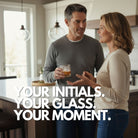 Man and woman in a kitchen with Monogrammed Ice Cube In Drink 'Your initial. Your glass. Your moment.'