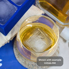 Close-up of whiskey glass with BM monogram ice cube made using custom ice tray – shown as example initials, your own initials can be used