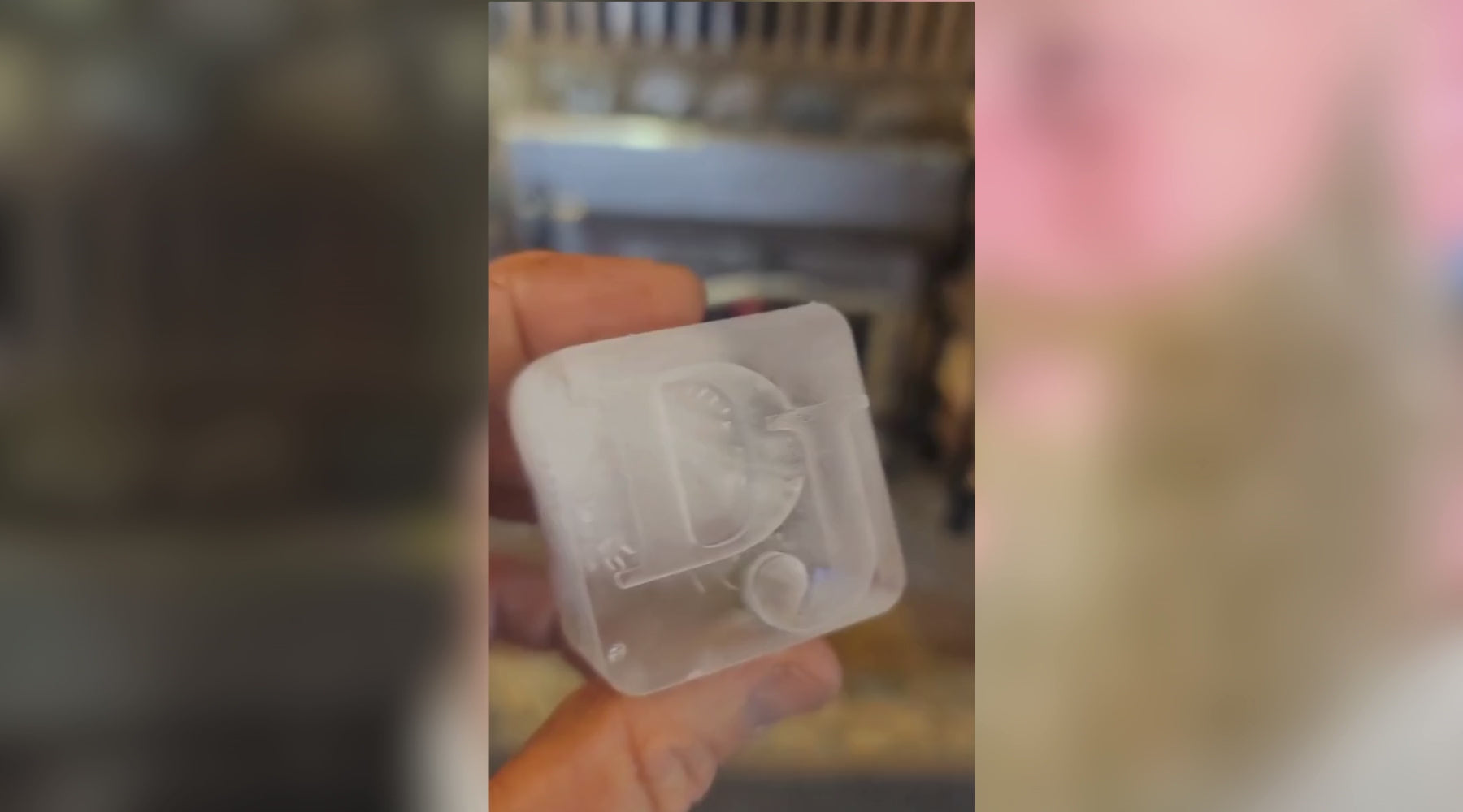 A man enjoying a drink while using a personalised ice tray featuring his initials ‘DJ’—demonstrating the unique, customisable experience of Chilled Out Creations’ signature ice trays.
