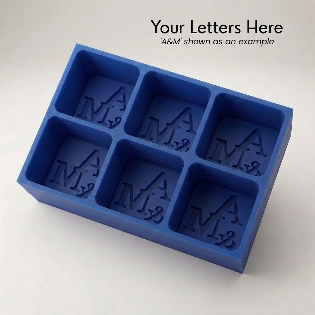 Personalized A&M monogram silicone ice cube tray in blue that makes six custom initial cubes