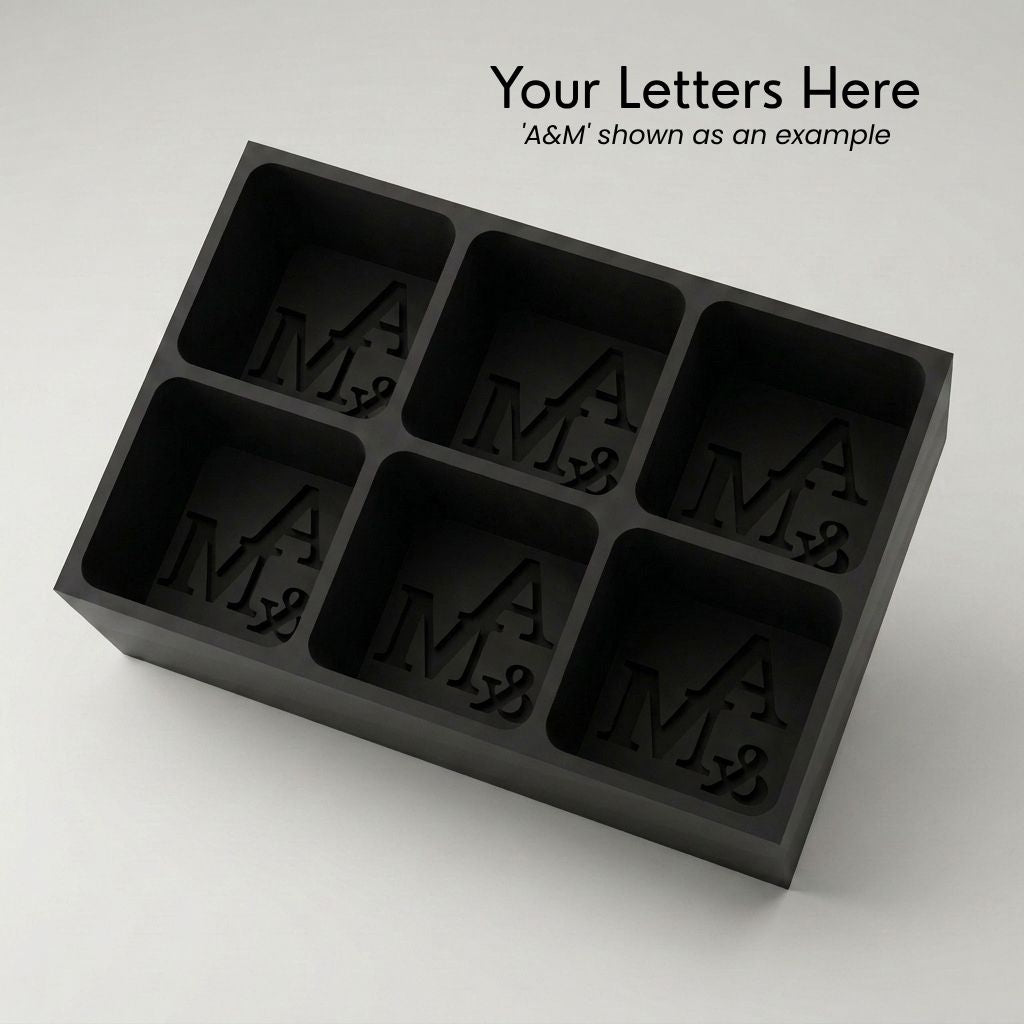 Personalized A&M monogram silicone ice cube tray in black that makes six custom initial cubes