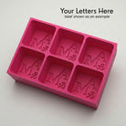 Personalized A&M monogram silicone ice cube tray in pink that makes six custom initial cubes