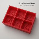 Personalized A&M monogram silicone ice cube tray in red that makes six custom initial cubes
