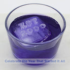 Purple cocktail with custom anniversary ice cubes featuring dates and numbers - romantic personalized drink celebration