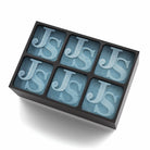 Matte black ice tray with six large JS initials frozen in each cube – a premium personalised gift for business, birthdays, or statement barware.