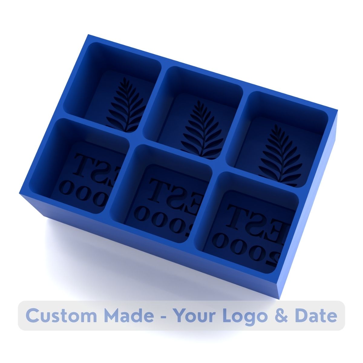 Empty blue silicone ice tray mold featuring fern leaf botanical design and EST 2000 custom text compartments