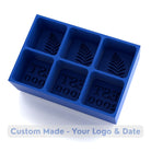 Empty blue silicone ice tray mold featuring fern leaf botanical design and EST 2000 custom text compartments