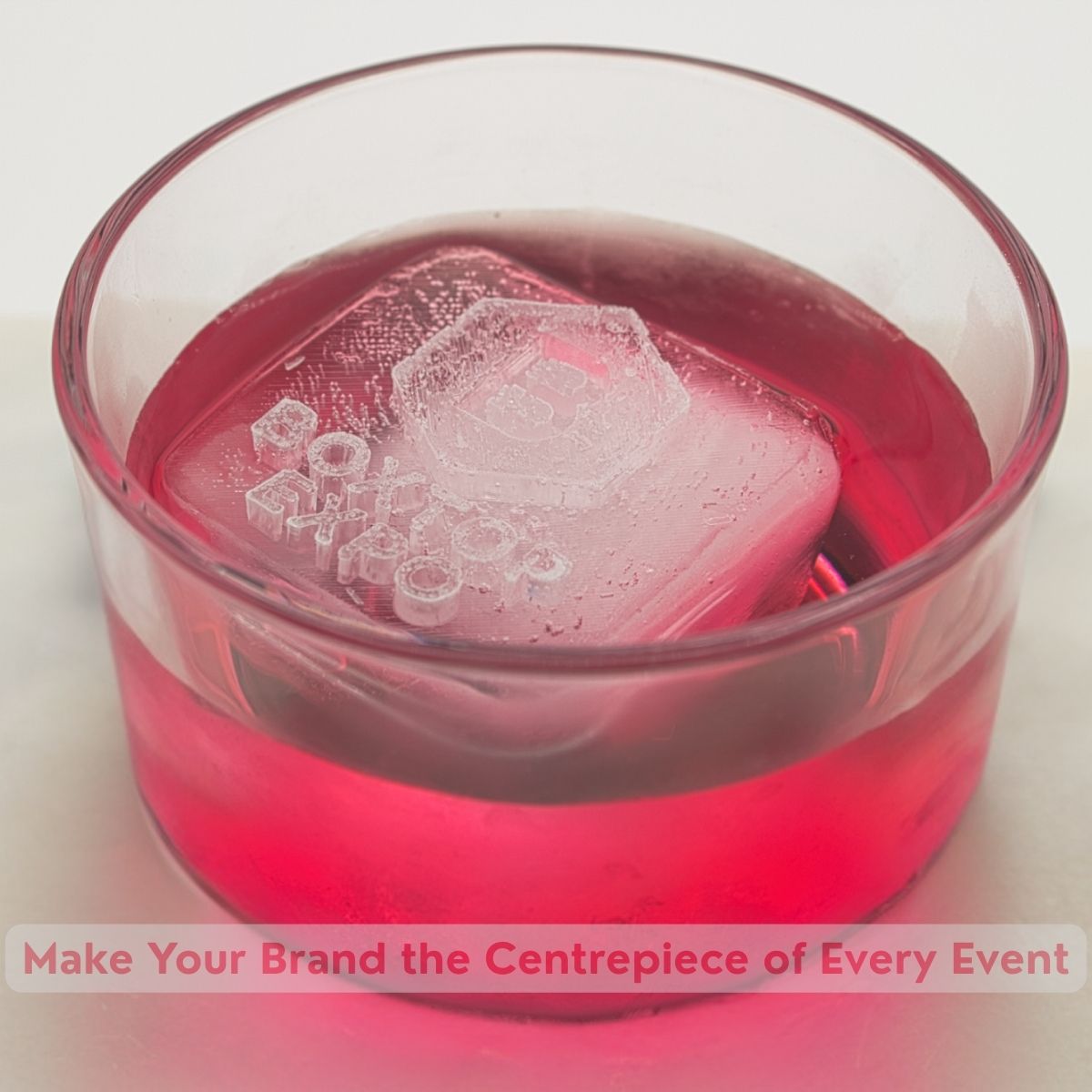 Pink drink with Boxtop Expo logo visible on ice cube, perfect for showcasing logos at corporate events