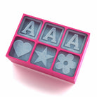 Pink engraved silicone tray with three large A letters and cheerful heart, star, and flower ice shapes – ideal for custom girl’s gifts or milestone birthdays.