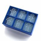 Blue silicone Christmas elf ice tray showing six slow-melting elf-shaped ice cubes with playful holiday character detail.