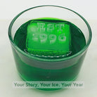 Green cocktail with floating custom ice cube featuring EST 1996 date text - personalized anniversary drink accessory