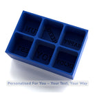 A blue 6-cube silicone tray showing custom engraved text areas, ready to create personalised message ice cubes for gifting or celebrations.