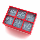 A red 6-cube silicone ice tray with custom designs including a name (MIA), a date (12.05.2025), word 'CHEERS', champagne glasses, initials (M & V), and music notes. Perfect for weddings, celebrations, or anniversaries.