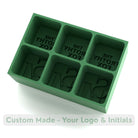 Green silicone ice tray for The Frothy Fox bar, custom moulds create ice cubes with engraved logos and initials.