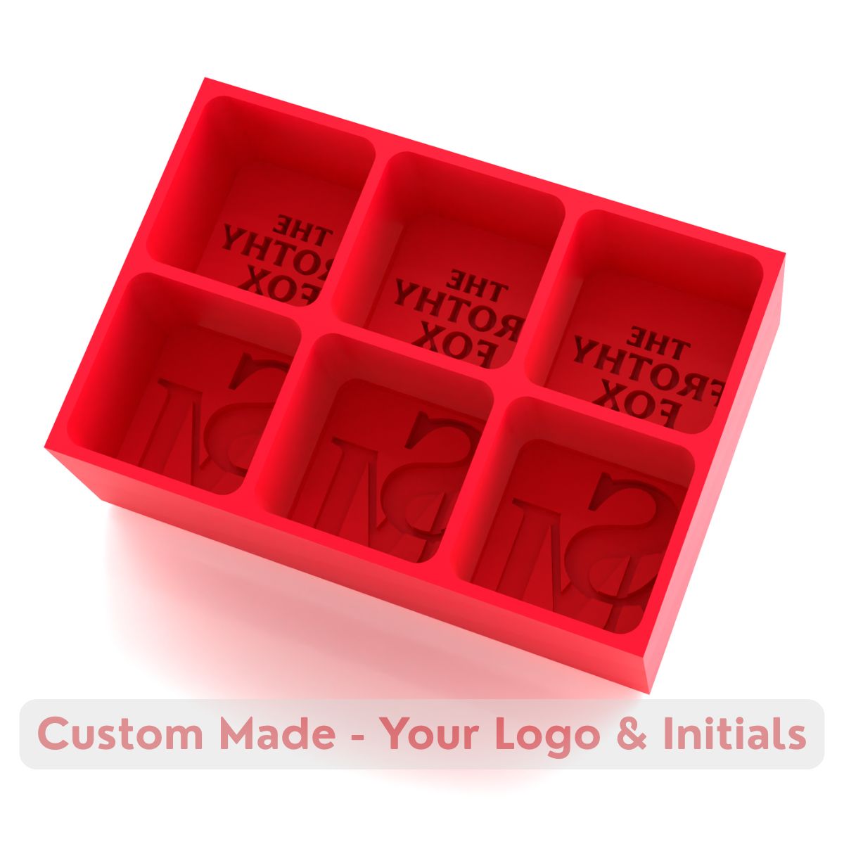 Red silicone tray producing six large ice cubes customised with The Frothy Fox bar’s logo and initials, ideal for drinks service.