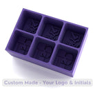 Deep purple silicone ice tray custom-made with logo and initials – bold impression mould for unforgettable branded ice.