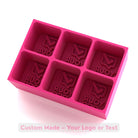 Pink custom silicone ice tray with six large cube cavities, sample engraving reading “Your Logo”, for personalised mould creation.