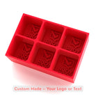 Red custom silicone ice tray with six cube cavities, engraved “Your Logo” as an example, for personalised moulds.
