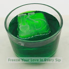 Fresh green cocktail with a personalised ice cube showing two initials and a heart symbol, perfect for weddings or anniversaries.