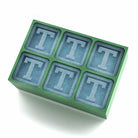 Vibrant green silicone ice tray with six ‘T’ cubes – an eco-friendly, personalised gift for celebrations, friends, and family.